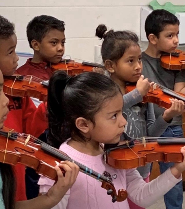 The students with their real violins