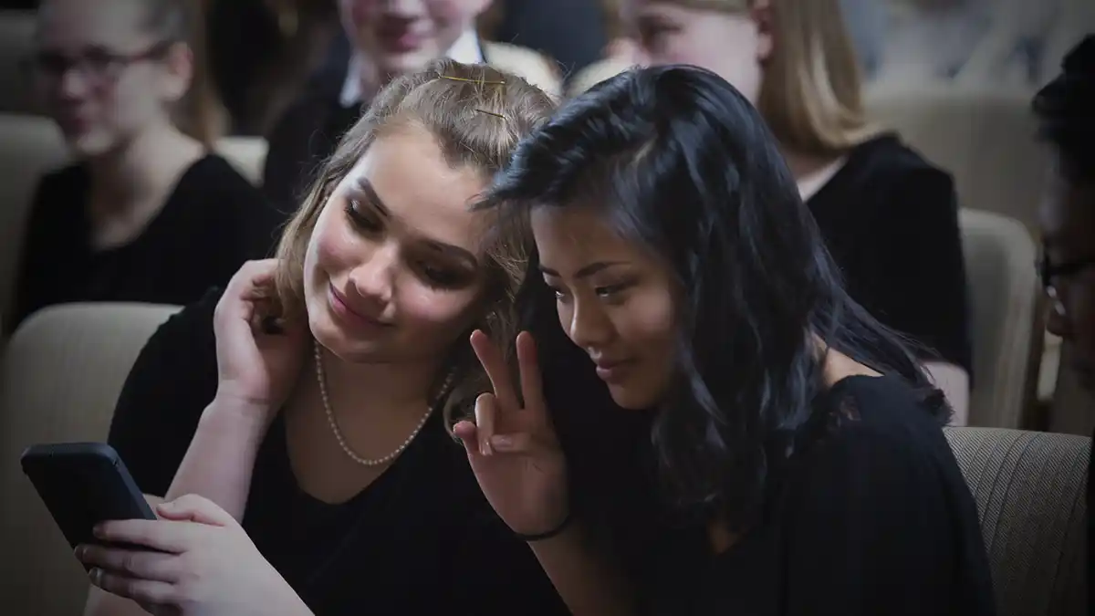 Two Youth Symphony students posing for a selfie.